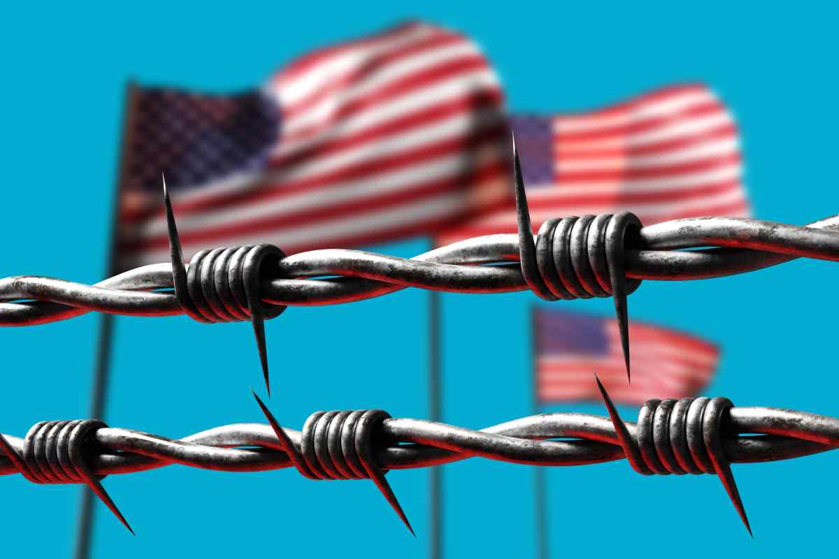 USA flags behind barbed wire