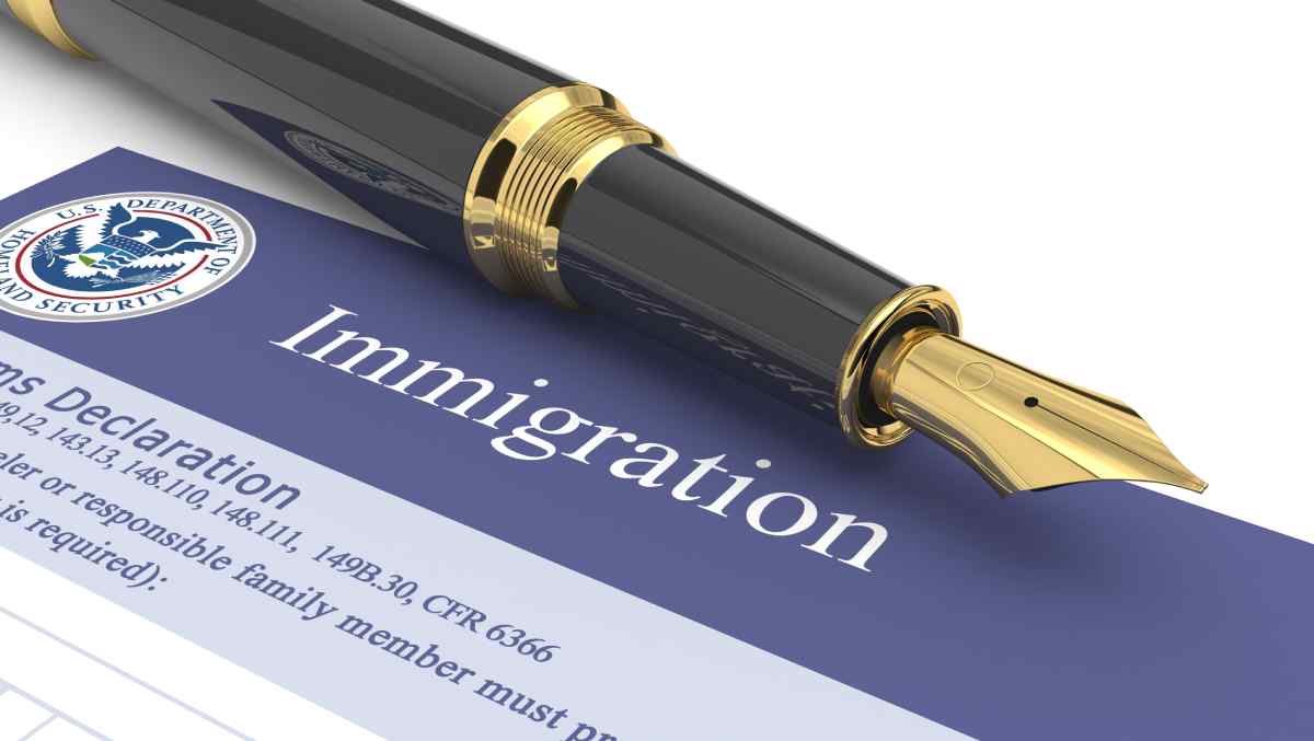 Fountain pen on top of immigration form