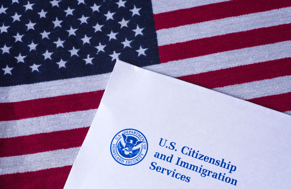 Letter from US Citizenship and Immigration Services on Flag of United States of America