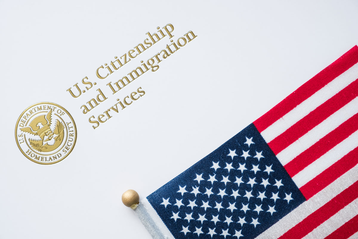 Envelope from U.S. Citizenship and Immigration Services with American flag on top
