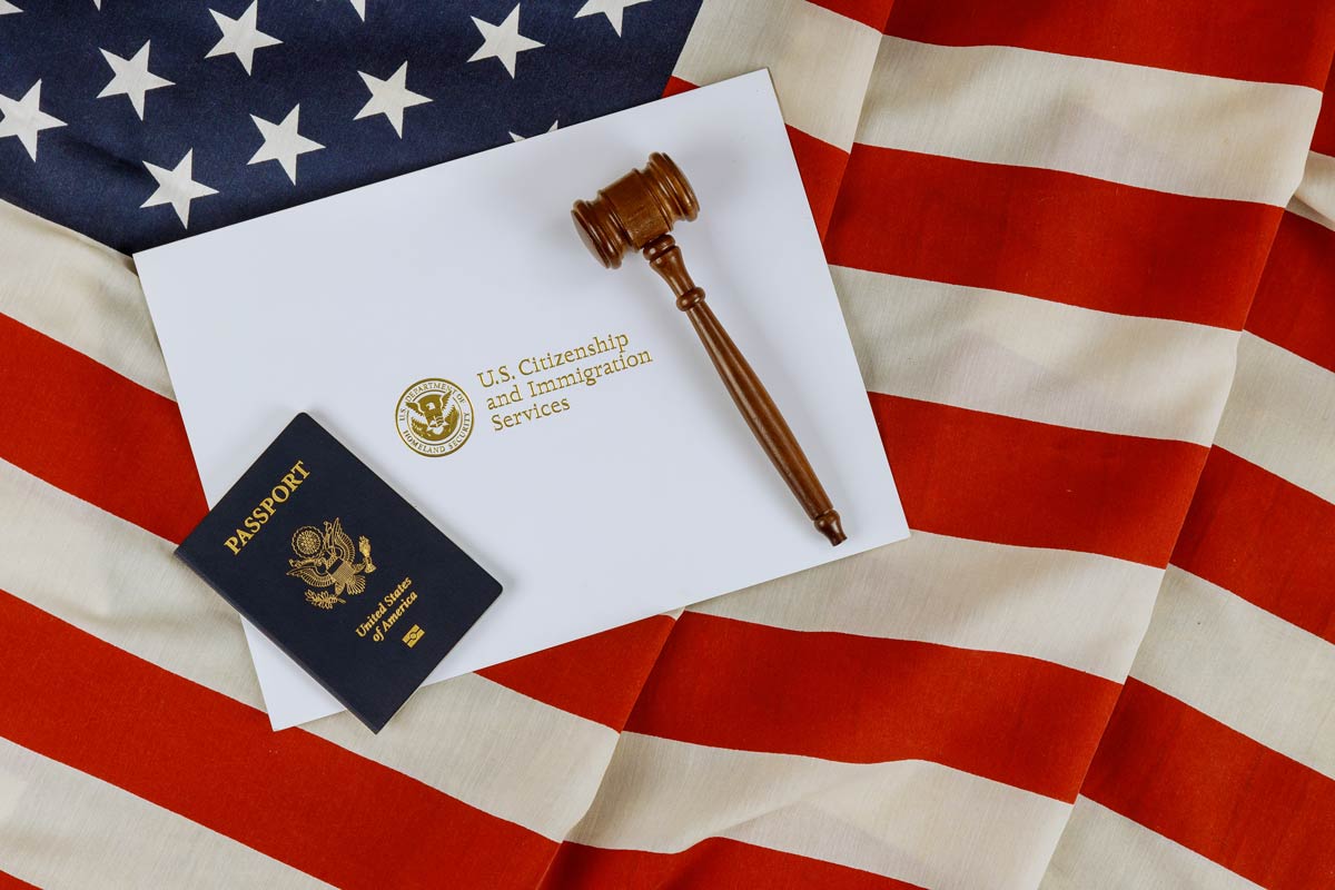 US Passports with wooden judge gavel on American flag